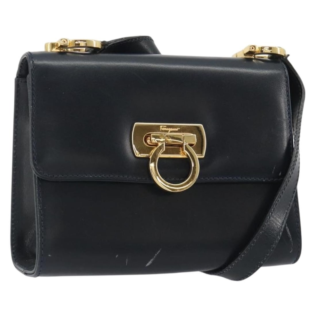 Salvatore Ferragamo Gancini Leather Shoulder Bag Navy Gold Italy: Salvatore Ferragamo Gancini Leather Shoulder Bag Navy Gold Italy Navy and gold Salvatore Ferragamo Gancini shoulder bag crafted from leather and made in Italy. It features a shoulder bag style with ap
