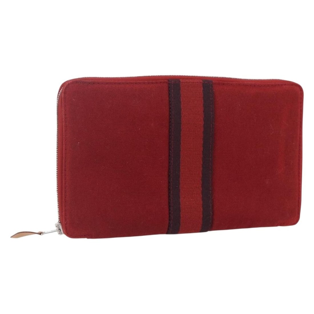 Red Canvas Fourre Tout Perth GM Long Wallet by Hermes: Red Canvas Fourre Tout Perth GM Long Wallet by Hermes This Hermes Fourre Tout Perth GM Long Wallet is crafted from red canvas and designed for women. The wallet features a spacious interior and a slee