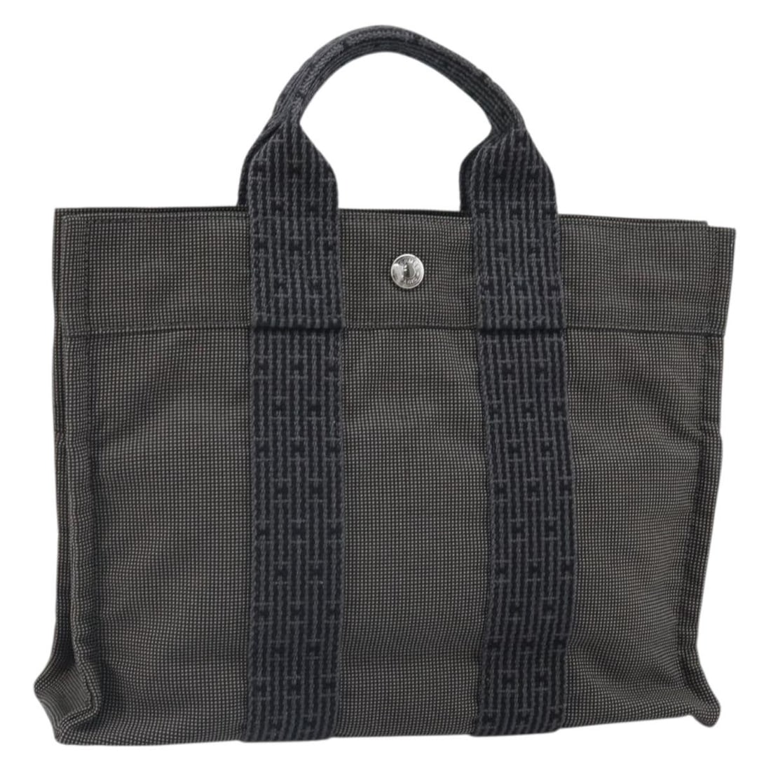 Hermes Her Line PM Gray Canvas Handbag Made in France: Hermes Her Line PM Gray Canvas Handbag Made in France Hermes Her Line PM handbag in gray canvas, made in France. This handbag measures approximately W30 cm x H23 cm x D8 cm, with a handle drop of appr