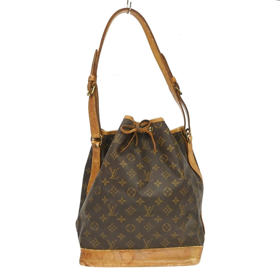 Louis Vuitton Noe Monogram Canvas Shoulder Bag M42224 AR0933: Louis Vuitton Noe Monogram Canvas Shoulder Bag M42224 AR0933 Vintage Louis Vuitton Noe shoulder bag in Monogram canvas with leather trim and an adjustable shoulder strap. This drawstring style is made