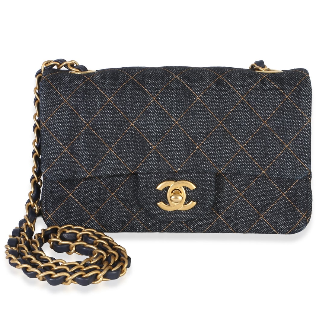 Chanel Mini Rectangular Flap Bag Blue Quilted Denim: Chanel Mini Rectangular Flap Bag Blue Quilted Denim Pre-owned Chanel Mini Rectangular Flap Bag in dark blue quilted denim. This unisex shoulder bag features a turnlock closure, blue leather lining, an