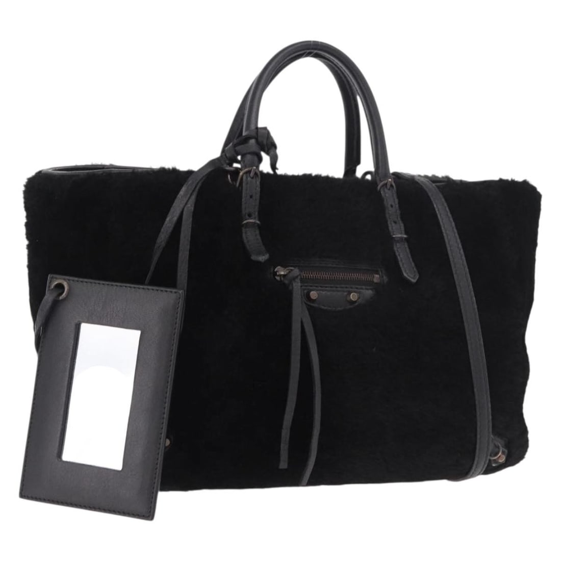 Balenciaga Black Fur 2way Handbag with Shoulder Strap Mirror: Balenciaga Black Fur 2way Handbag with Shoulder Strap Mirror Balenciaga hand bag in black fur, made in Italy. This 2-way style comes with a shoulder strap and mirror. The bag measures approximately