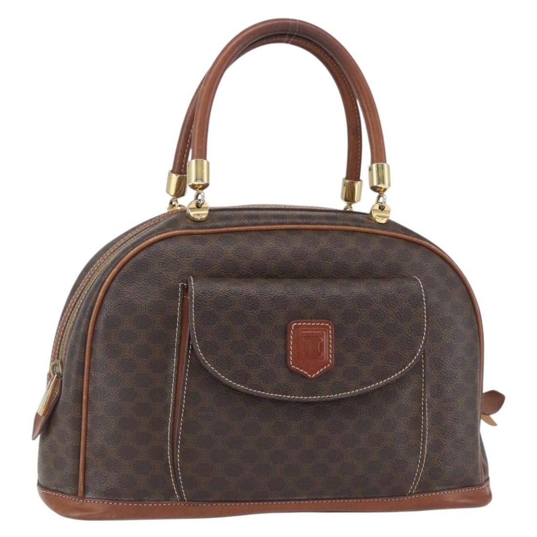 Celine Macadam Brown PVC and Leather Handbag Gold Accents: Celine Macadam Brown PVC and Leather Handbag Gold Accents This CELINE Macadam hand bag features brown and gold PVC leather with the iconic Macadam canvas design. Made in Italy, the bag has a structure