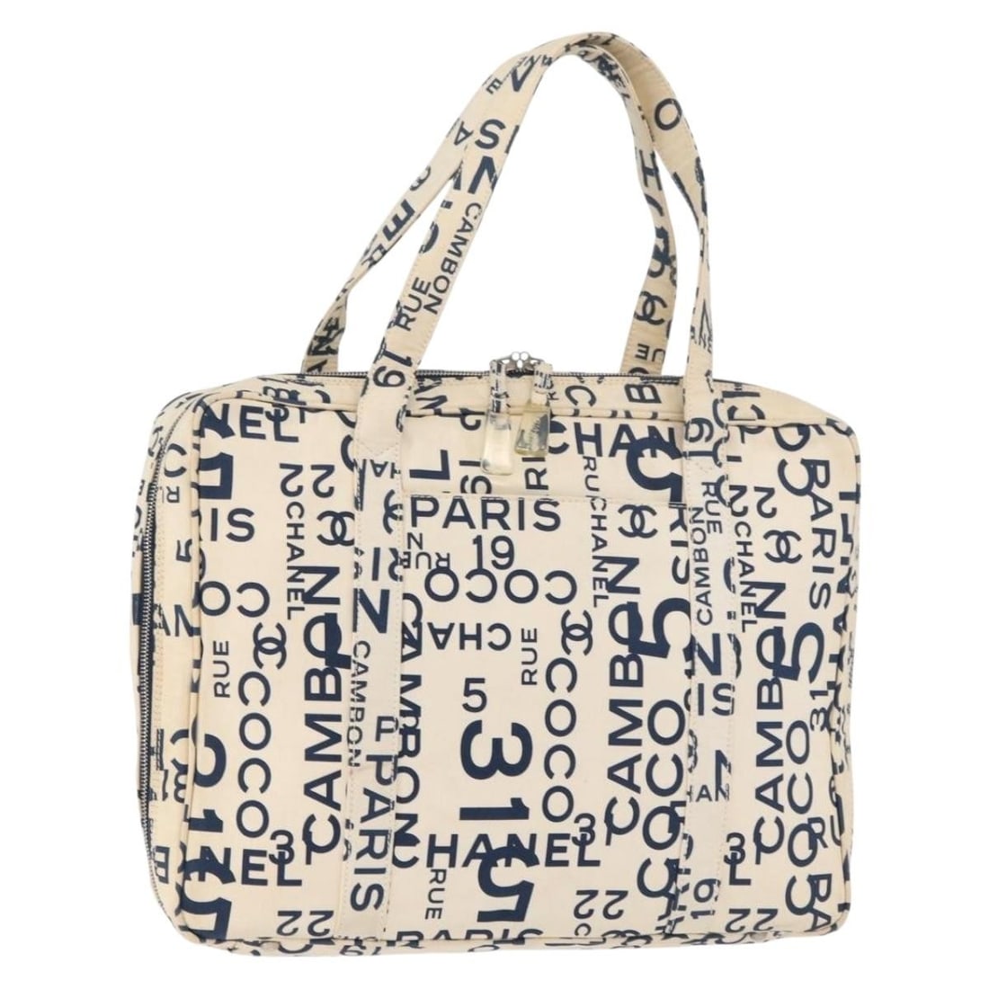 CHANEL By Sea Line Canvas Tote in White and Silver: CHANEL By Sea Line Canvas Tote in White and Silver Chanel By Sea Line tote bag in white and silver canvas. This women's tote is made in Italy and features a spacious everyday silhouette with a handle 