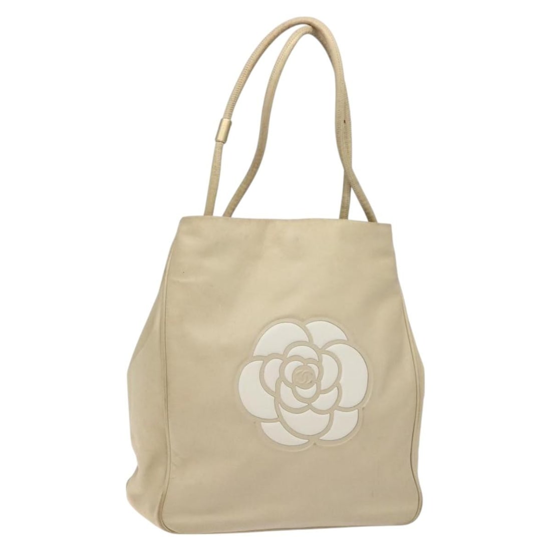 Chanel Camelia Beige Lamb Skin Tote Bag Gold CC France: Chanel Camelia Beige Lamb Skin Tote Bag Gold CC France A CHANEL Camelia tote bag in beige and gold lamb skin, made in France. This pre-owned bag is identified as style rank C and shows heavy use, with