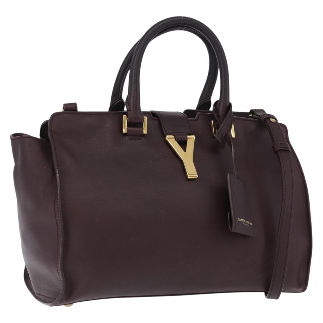 Saint Laurent Petit Cabas 2way Leather Handbag Purple Gold: Saint Laurent Petit Cabas 2way Leather Handbag Purple Gold Saint Laurent petit cabas hand bag in leather, presented in purple and gold. This 2-way style includes a shoulder strap and clochette, and wa