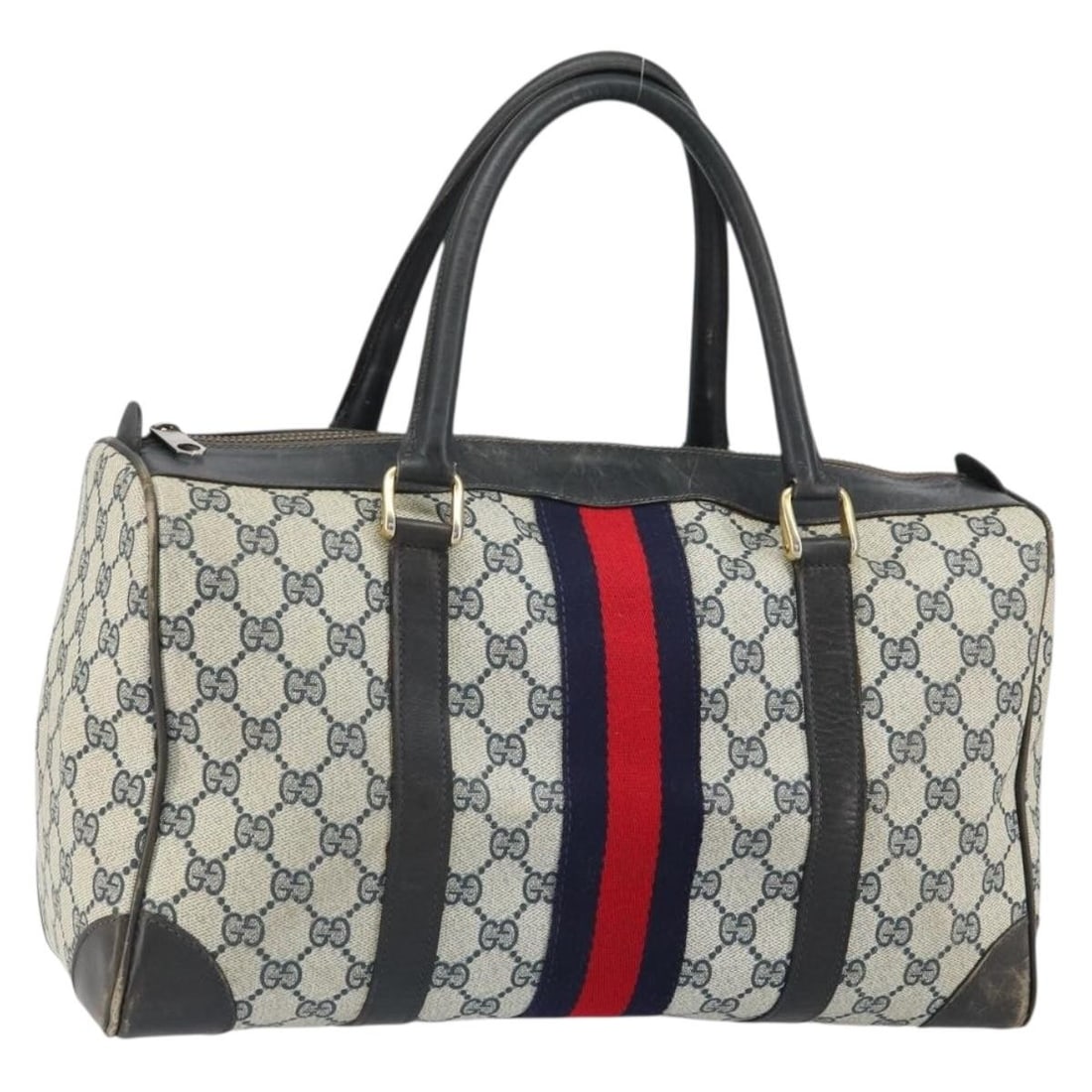 Navy Gold GG Supreme Boston Handbag by Gucci in PVC Leather: Navy Gold GG Supreme Boston Handbag by Gucci in PVC Leather This is a Gucci GG Supreme Boston Bag crafted from a combination of PVC leather and GG canvas in navy and gold tones. The bag features a spa