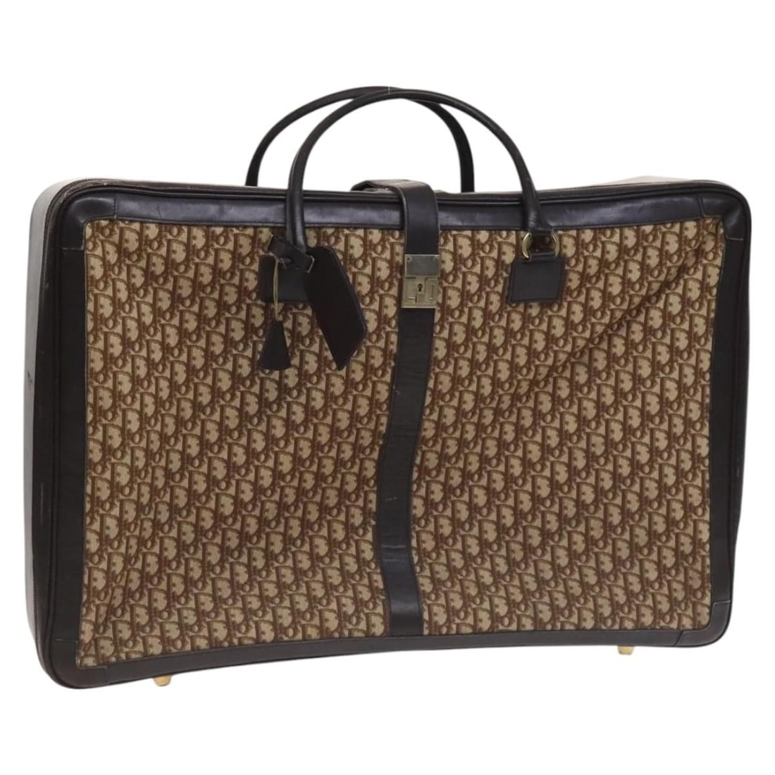 Christian Dior Trotter canvas suitcase in brown with key and clochette: Christian Dior Trotter canvas suitcase in brown with key and clochette Christian Dior Trotter Canvas suitcase in brown, made in France. It comes with one key and a clochette. The item is heavily used 
