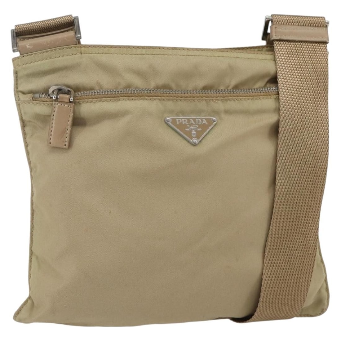 Prada beige silver nylon women s shoulder bag Italy: Prada beige silver nylon women s shoulder bag Italy This PRADA shoulder bag is crafted from beige nylon with silver-tone accents. Designed for women, it offers a practical and stylish option with an a
