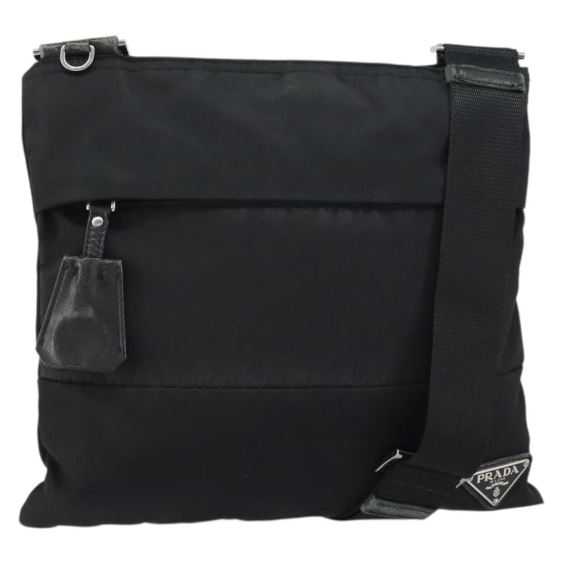 Prada nylon black silver women s shoulder bag Italy: Prada nylon black silver women s shoulder bag Italy This PRADA shoulder bag is crafted from black nylon with silver-tone accents, designed for women. Made in Italy, it features a practical shoulder st