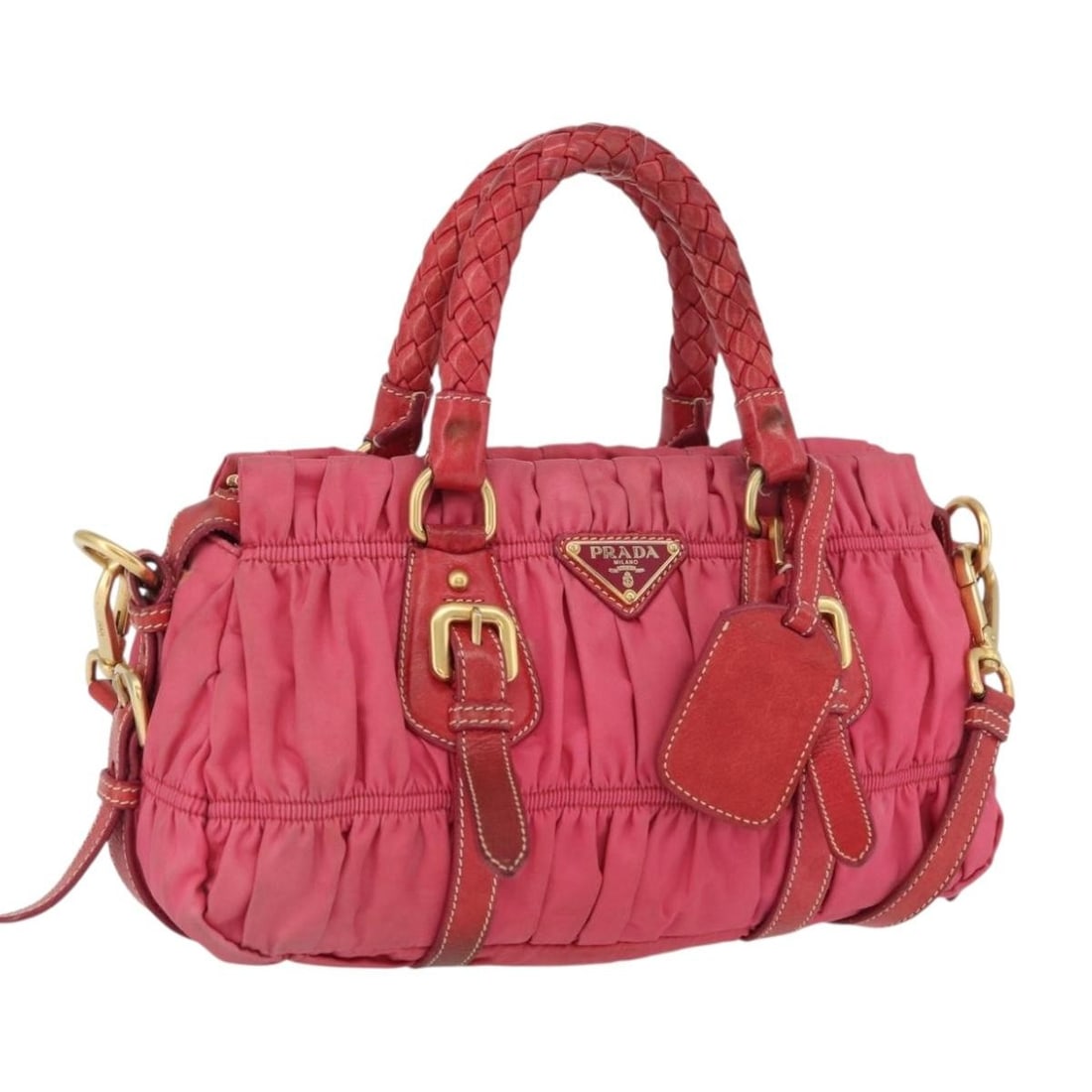 Prada Pink Nylon Leather Convertible Shoulder Bag with Gold Accents: Prada Pink Nylon Leather Convertible Shoulder Bag with Gold Accents This PRADA 2-way shoulder bag for women is crafted from pink and gold nylon with leather accents. The bag features both a shoulder s