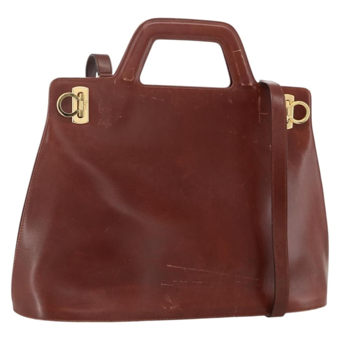 Salvatore Ferragamo Gancini leather 2way brown gold handbag with strap: Salvatore Ferragamo Gancini leather 2way brown gold handbag with strap This Salvatore Ferragamo Gancini handbag is crafted from brown leather with gold-tone accents. Designed for versatile use, it fea