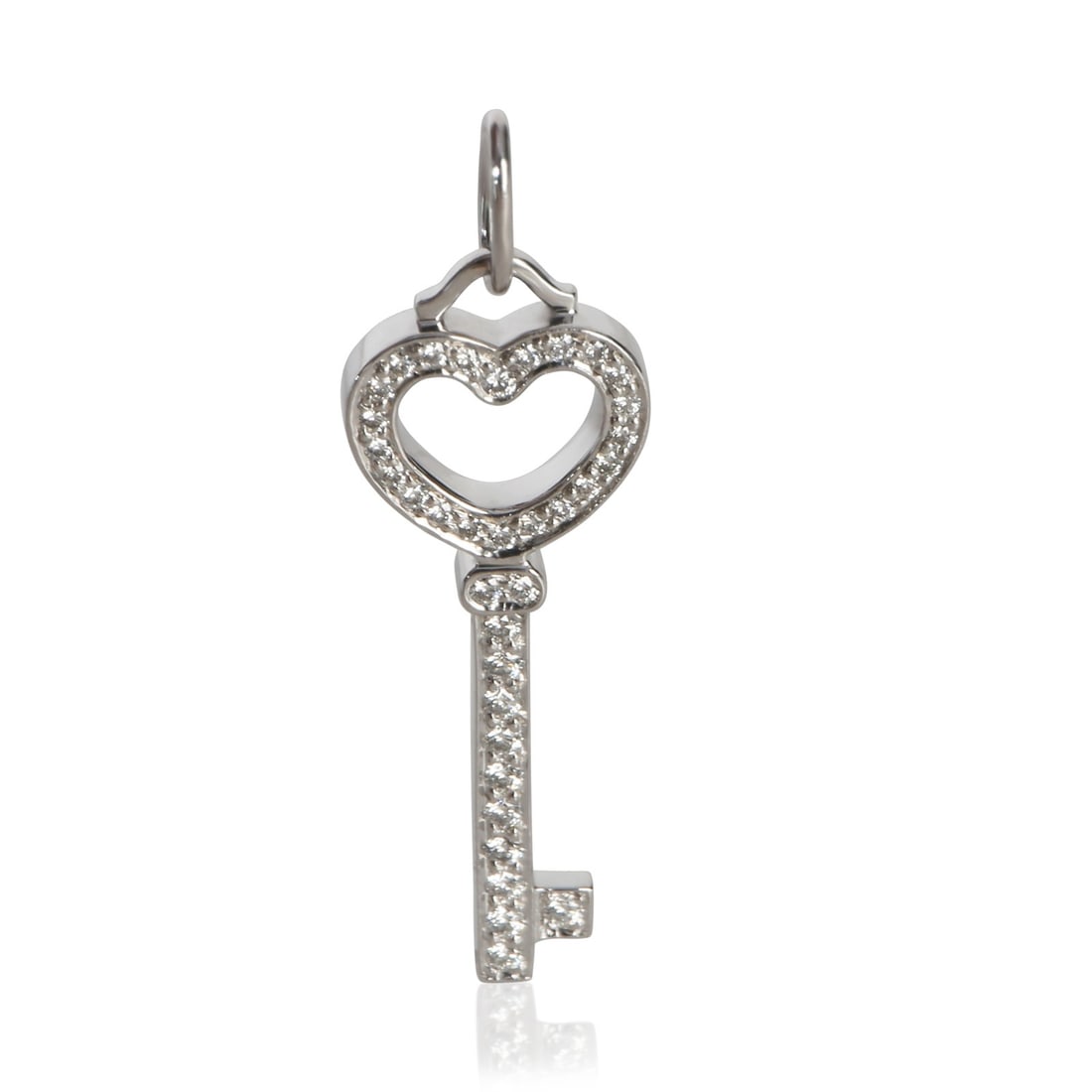Tiffany Co Mini Heart Key Platinum Diamond Pendant: Tiffany Co Mini Heart Key Platinum Diamond Pendant This pre-owned Tiffany & Co. Mini Heart Key pendant is crafted from platinum and features round brilliant diamonds totaling 0.30 carats with a VS1 cl