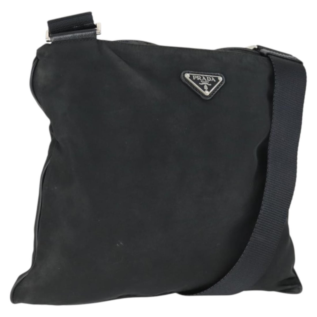 Black Nylon Shoulder Bag by Prada with Silver Accents: Black Nylon Shoulder Bag by Prada with Silver Accents This Prada shoulder bag features a black and silver nylon exterior crafted in Italy. The bag measures approximately 11.8 inches in width and 10.2 
