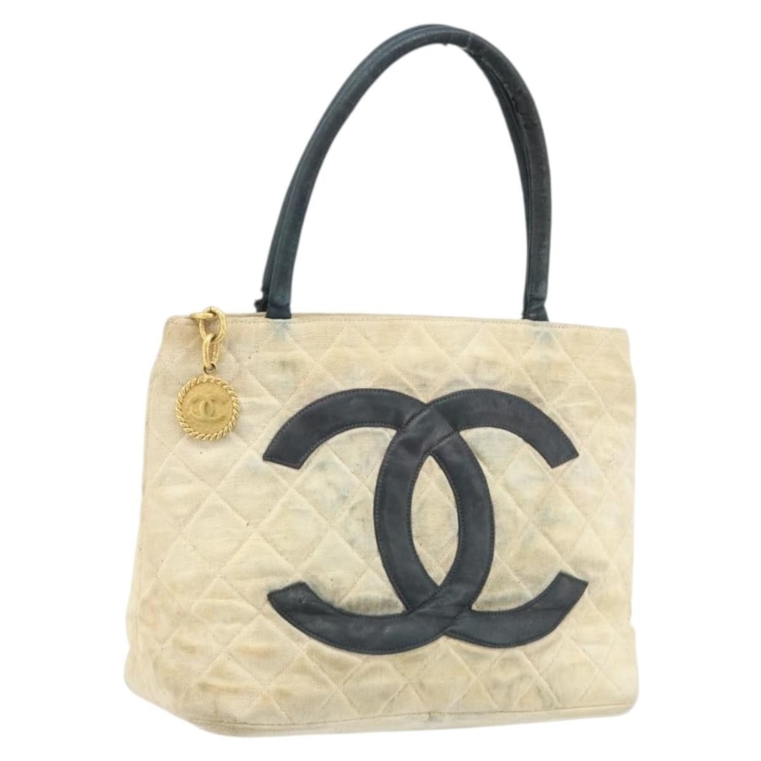 CHANEL CC Canvas Tote Handbag Beige Gold France: CHANEL CC Canvas Tote Handbag Beige Gold France CHANEL Standard Tote Bag in beige and gold canvas, made in France. This women's tote bag features a structured size of approximately 30 cm W x 24 cm H x