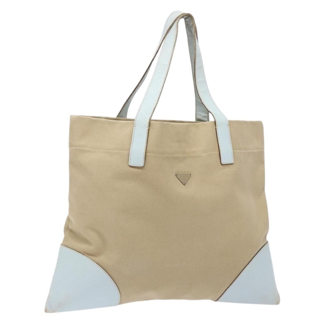 PRADA Beige Canvas Tote Bag Made in Italy 137463: PRADA Beige Canvas Tote Bag Made in Italy 137463 This authentic PRADA tote bag showcases a chic beige canvas exterior, perfect for adding a touch of sophistication to your ensemble. Designed for pract