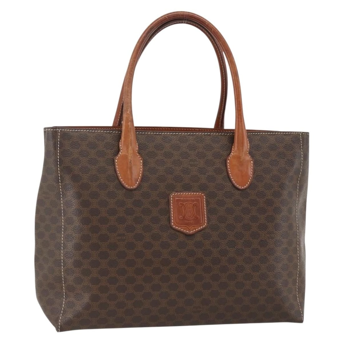 Celine Macadam Brown PVC Leather Handbag with Gold Accents: Celine Macadam Brown PVC Leather Handbag with Gold Accents This CELINE Macadam Canvas hand bag features a brown and gold color scheme, crafted from PVC leather and Macadam canvas. Designed for women, 