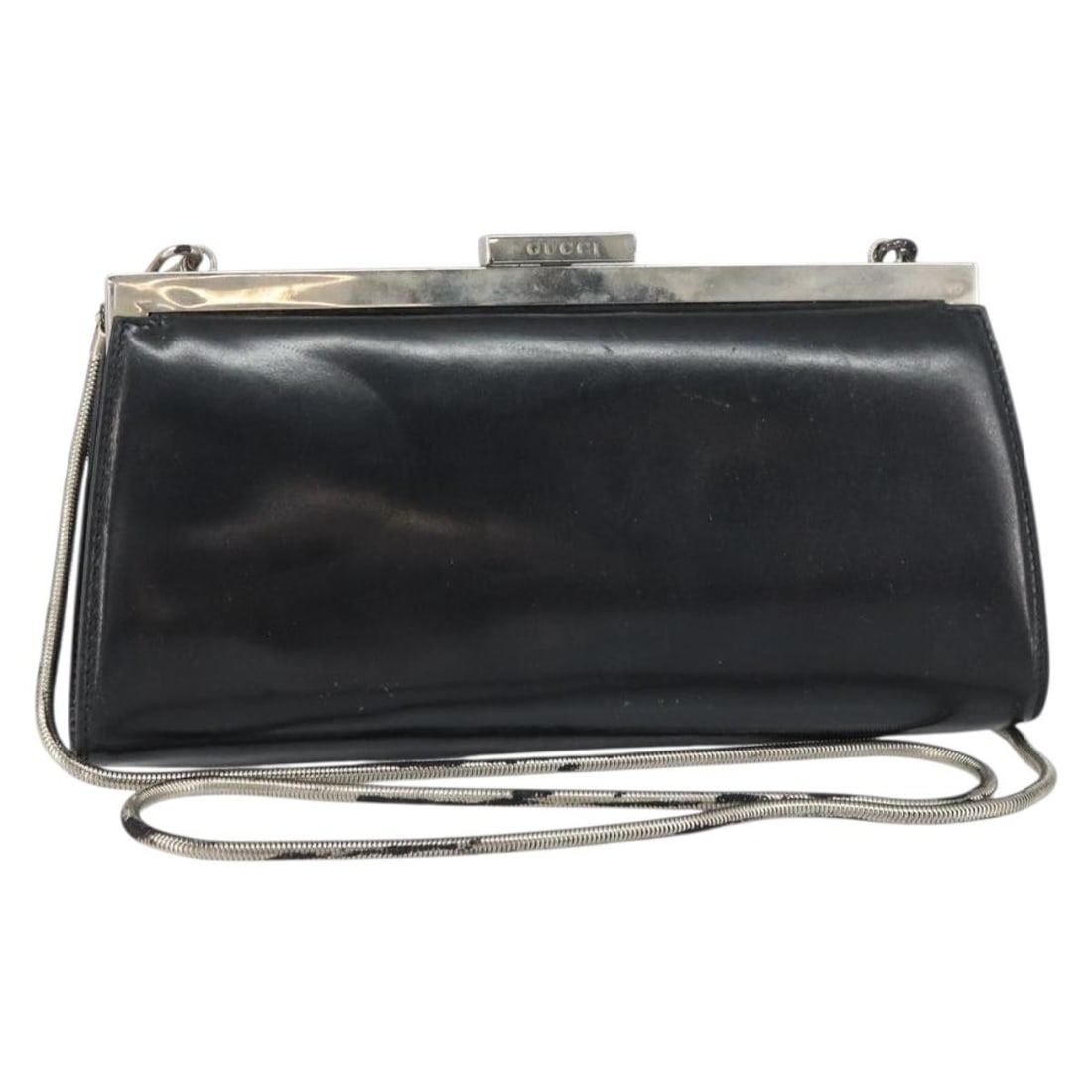 Black Leather Gucci Shoulder Bag with Silver Tone Chain: Black Leather Gucci Shoulder Bag with Silver Tone Chain This GUCCI chain shoulder bag features black leather with silver-tone accents and is crafted in Italy. The bag has a compact design, suitable fo