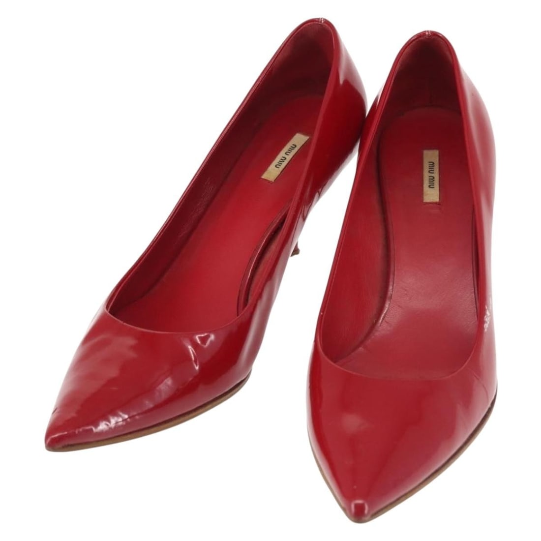 Miu Miu Red Patent Leather High Heels Made in Italy: Miu Miu Red Patent Leather High Heels Made in Italy Step into elegance with these Miu Miu high heels, crafted from luxurious patent leather in a striking red hue. Designed in Italy, these heels showca