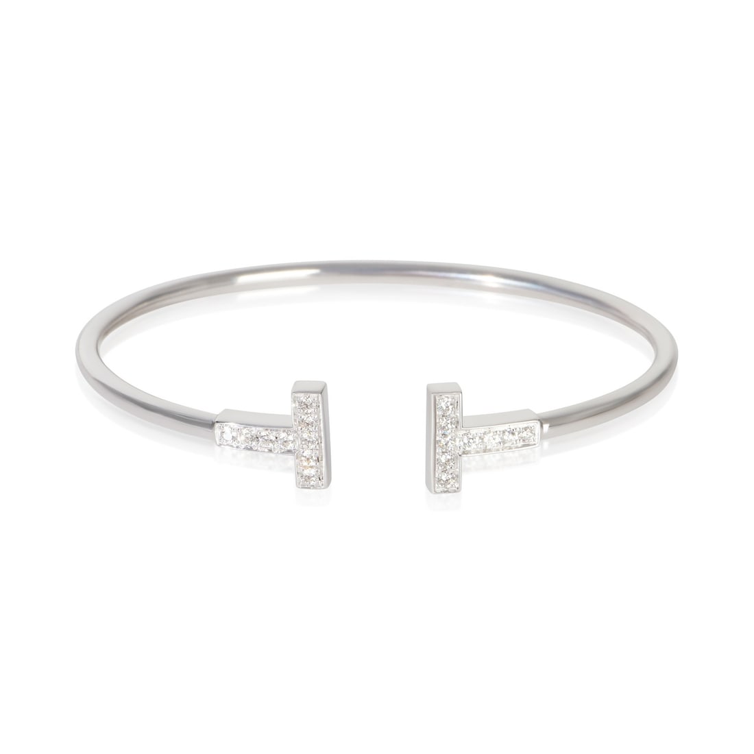 18k White Gold Diamond Bracelet Tiffany and Co Tiffany T Wire: 18k White Gold Diamond Bracelet Tiffany and Co Tiffany T Wire A pre-owned Tiffany T Wire bracelet from Tiffany & Co.'s Tiffany T Collection, crafted in 18k white gold with diamonds. It measures 6 in l