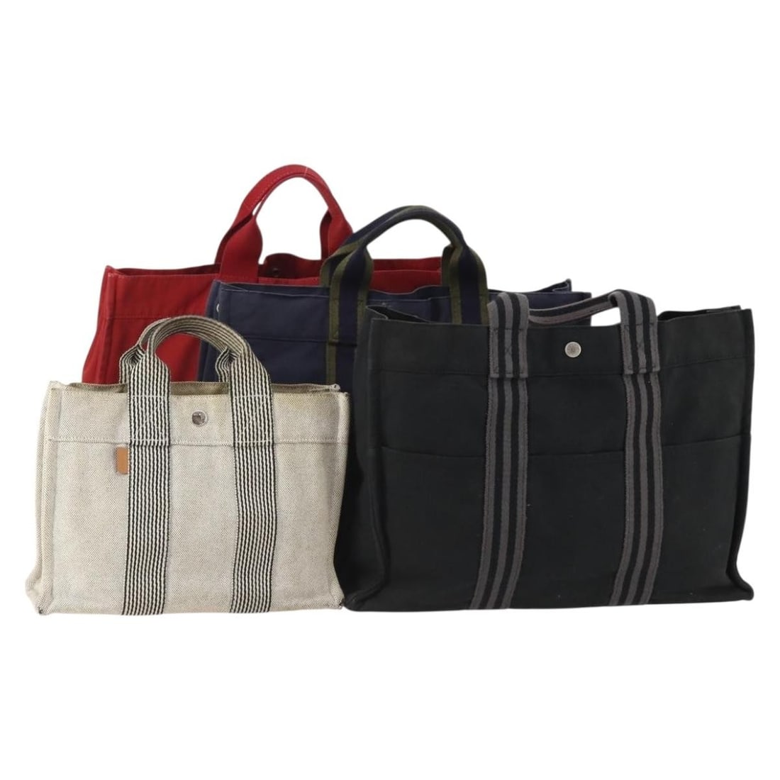 Set of 4 Hermes Fourre Tout Cotton Hand Bags White Black Red: Set of 4 Hermes Fourre Tout Cotton Hand Bags White Black Red Hermes Fourre Tout hand bag set in white, black, and red cotton. Made in France, this listing is for the item shown in the photo only and d