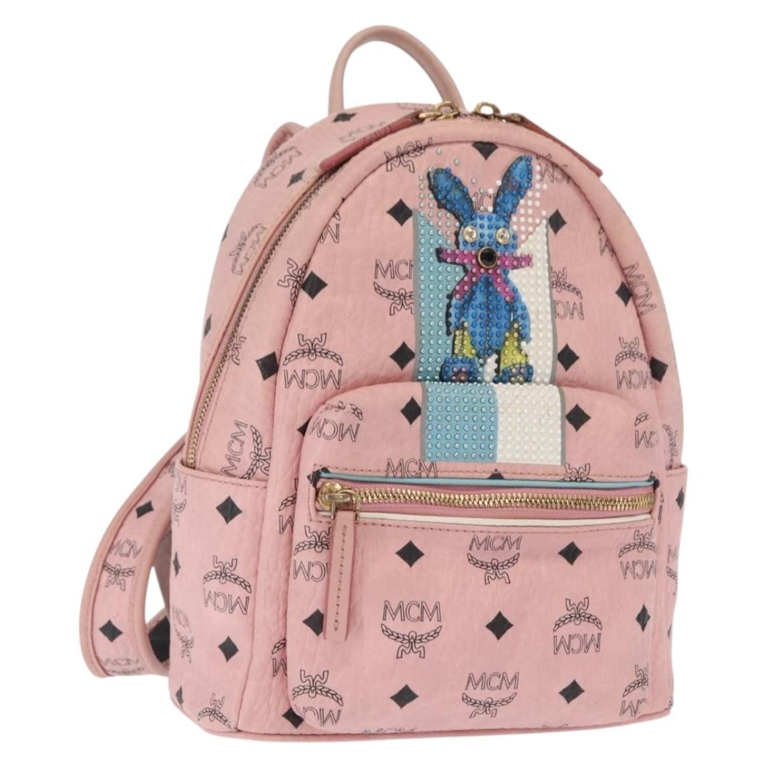 Pink PVC Leather MCM Vicetos Logogram Backpack Gold Tone Accents: Pink PVC Leather MCM Vicetos Logogram Backpack Gold Tone Accents This MCM Vicetos Logogram backpack features a pink and gold PVC leather exterior with signature branding. The backpack offers a compact