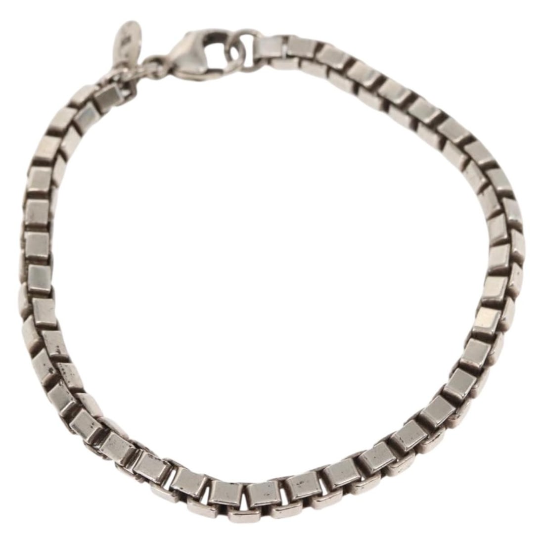 Tiffany & Co. Venetian Bracelet Ag925 Silver Authentic SW1654: Tiffany & Co. Venetian Bracelet Ag925 Silver Authentic SW1654 This Tiffany & Co. Venetian Bracelet is crafted from high-quality Ag925 silver, showcasing a sleek and timeless design. With a total lengt
