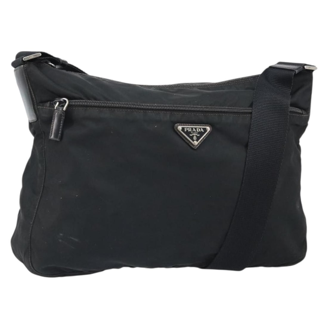 Prada Black Nylon Shoulder Bag with Silver Accents and Name Tag: Prada Black Nylon Shoulder Bag with Silver Accents and Name Tag This PRADA shoulder bag for women is crafted from durable black nylon with silver-tone accents. Made in Italy, it features a spacious ma