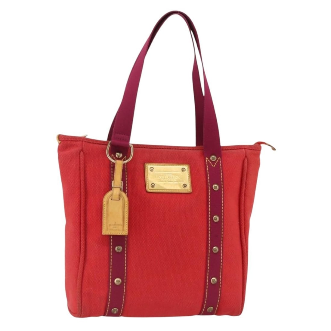 Louis Vuitton Antigua Cabas MM Red Canvas Tote M40034: Louis Vuitton Antigua Cabas MM Red Canvas Tote M40034 Louis Vuitton Antigua Cabas MM tote bag in red canvas, made in France. It comes with a name tag accessory and is identified by product no. M40034.