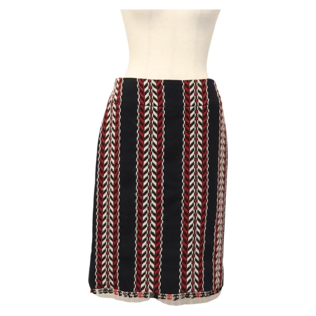 CHANEL Tweed Wool Skirt Navy Red CC France: CHANEL Tweed Wool Skirt Navy Red CC France A Chanel tweed skirt in navy and red, made in France from wool. The item is listed in heavily used condition with slight rubbing on the surface and inside, a