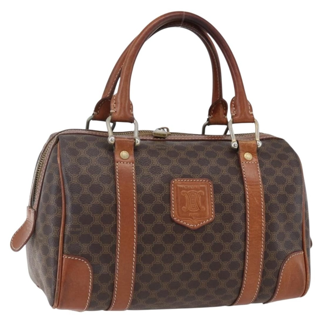Celine Macadam Brown PVC and Leather Handbag Gold Tone Accents: Celine Macadam Brown PVC and Leather Handbag Gold Tone Accents This CELINE Macadam Canvas hand bag features a brown and gold exterior crafted from PVC leather and Macadam canvas. The bag is made in It