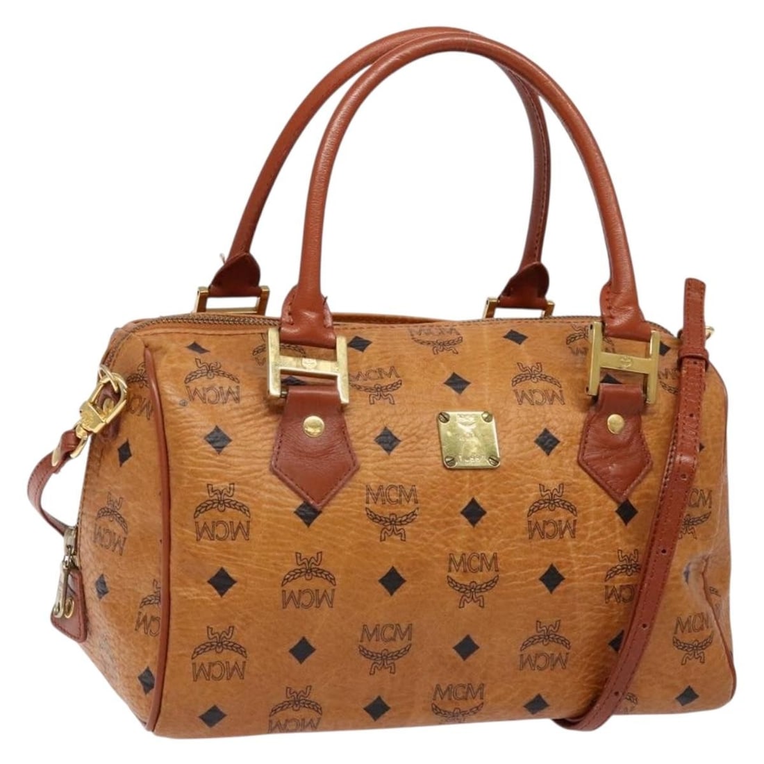 MCM Vicetos Mini Boston Bag Brown Gold PVC Leather 2way Strap: MCM Vicetos Mini Boston Bag Brown Gold PVC Leather 2way Strap This MCM Logogram Vicetos Mini Boston Bag is crafted from brown and gold PVC leather and features a classic Boston Bag silhouette. Designe