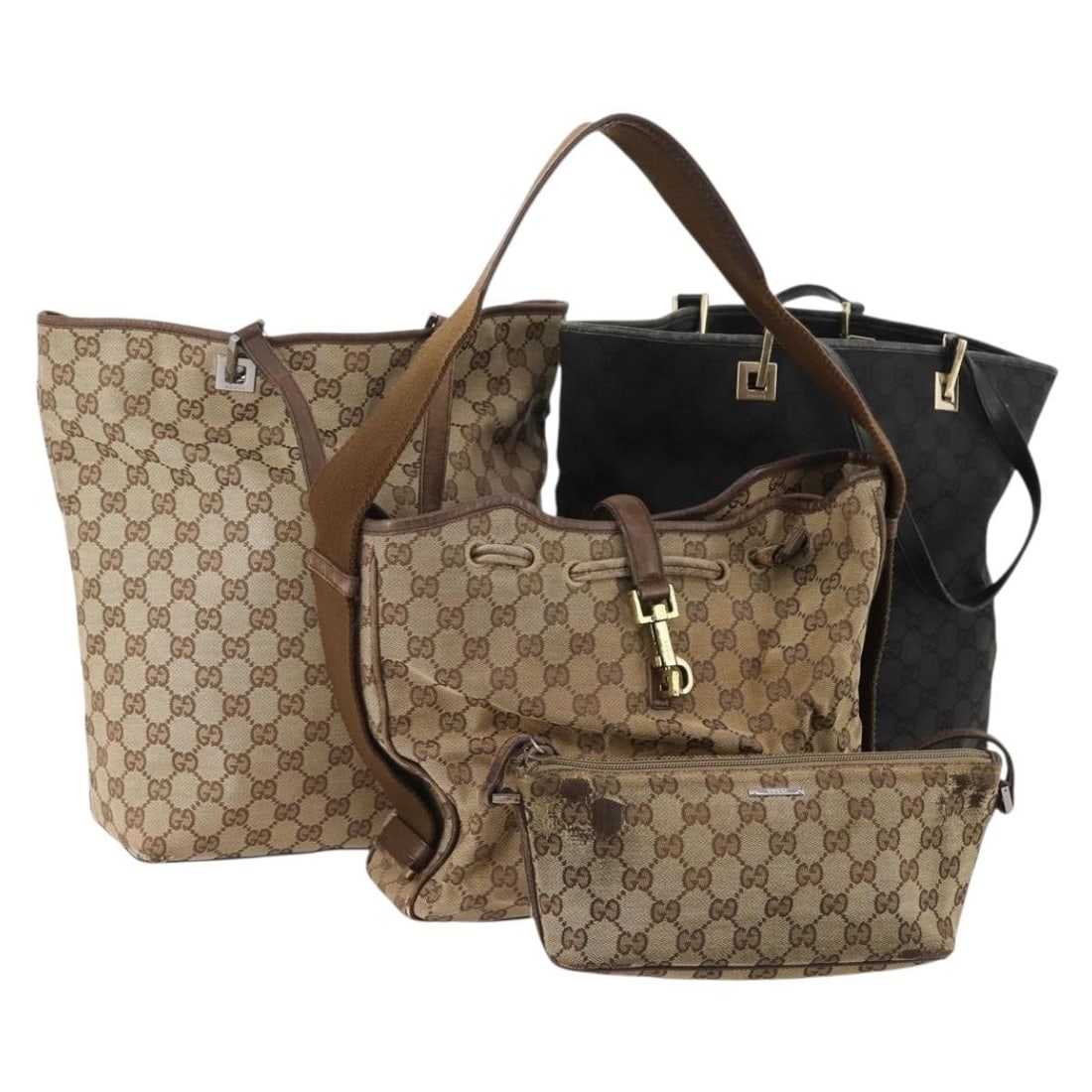 Set of 4 Gucci GG Canvas Handbags Black Beige Italy: Set of 4 Gucci GG Canvas Handbags Black Beige Italy This Gucci hand bag is made from GG Canvas in a black and beige colorway and was made in Italy. It is offered as a special bundle set and is being s