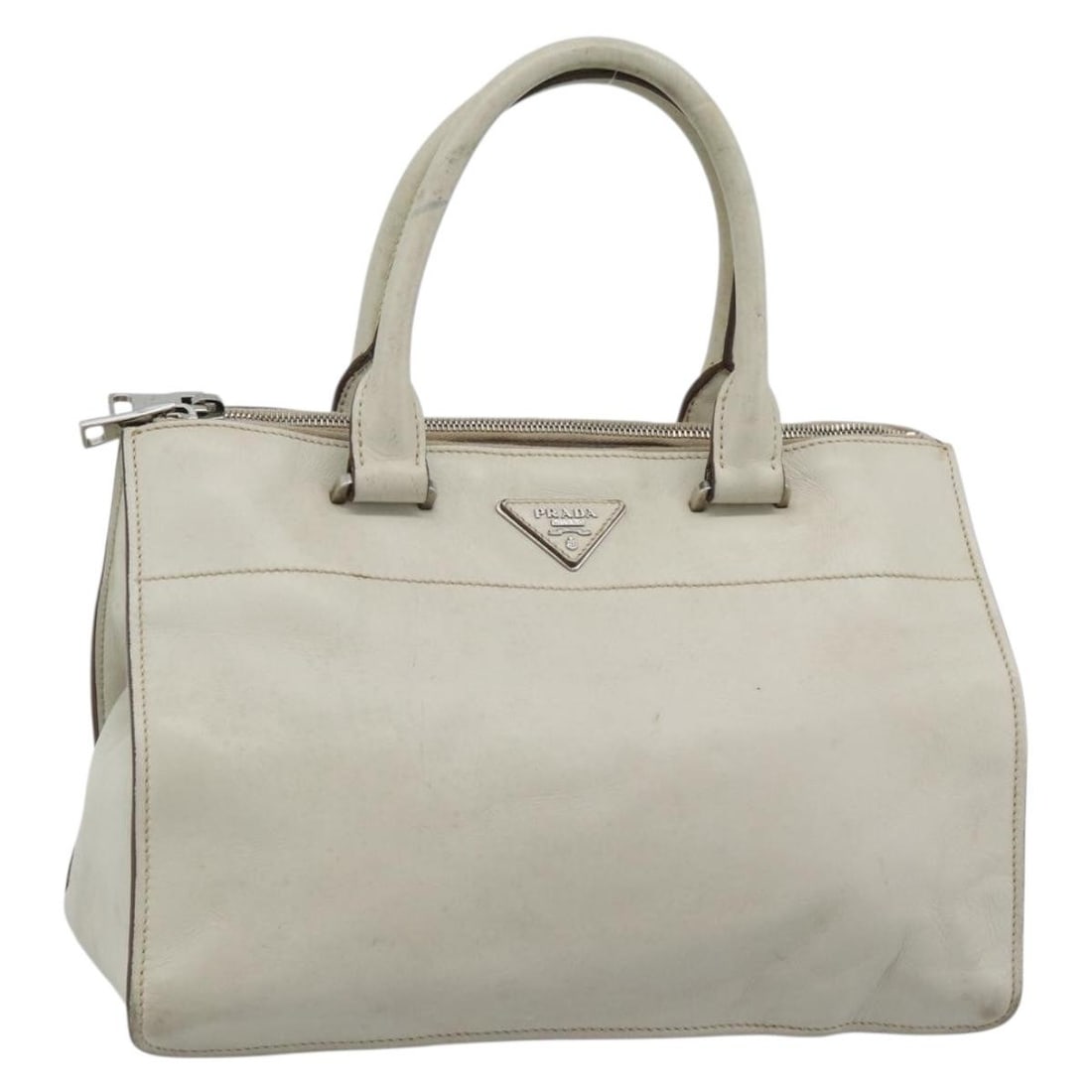 PRADA Ivory Silver Leather Hand Bag Made in Italy: PRADA Ivory Silver Leather Hand Bag Made in Italy PRADA women's hand bag crafted in leather with an ivory and silver color combination. Made in Italy, this bag measures approximately 32 cm wide, 23 cm