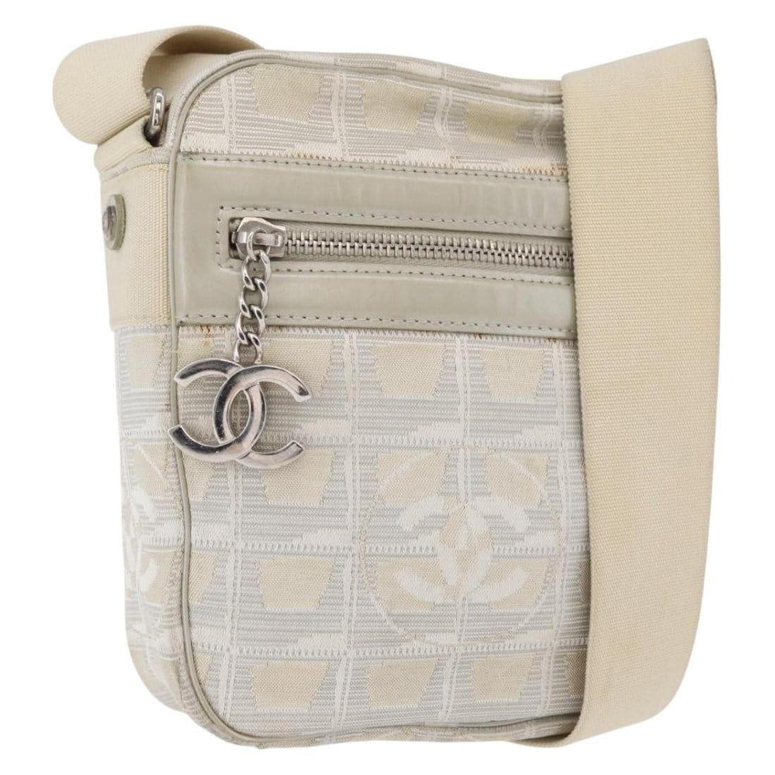 CHANEL CC New Travel Line Beige Nylon Shoulder Bag: CHANEL CC New Travel Line Beige Nylon Shoulder Bag CHANEL New Travel Line shoulder bag in beige nylon with CC detailing. This women's shoulder bag includes a dust bag and guarantee card. Condition is 