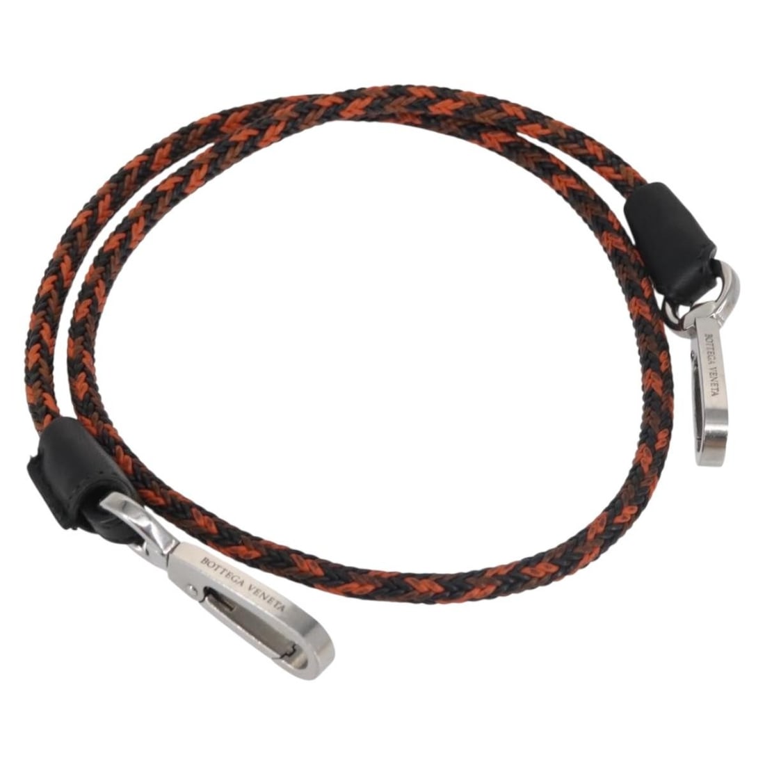 Bottega Veneta Orange Leather Strap Accessory: Bottega Veneta Orange Leather Strap Accessory This Bottega Veneta strap is crafted from high-quality leather in a vibrant orange color, making it a stylish accessory for any outfit. With an approximat