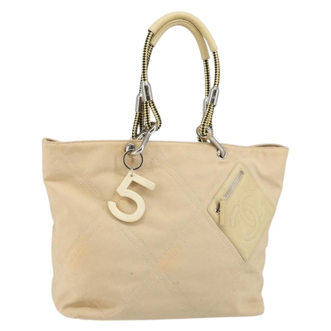 CHANEL Beige Silver Canvas Hand Bag with Guarantee Card: CHANEL Beige Silver Canvas Hand Bag with Guarantee Card Authentic CHANEL women's hand bag in beige and silver canvas, made in Italy. This pre-owned bag includes the guarantee card and shows heavy use 