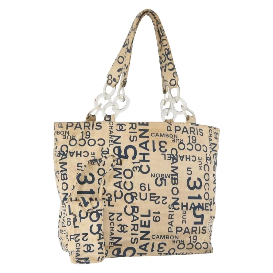 CHANEL White Silver Canvas Tote with Pouch Italy: CHANEL White Silver Canvas Tote with Pouch Italy This CHANEL By Sea Line tote bag features a white and silver canvas exterior with silver-tone CC accents. Designed for women, it offers a spacious inte