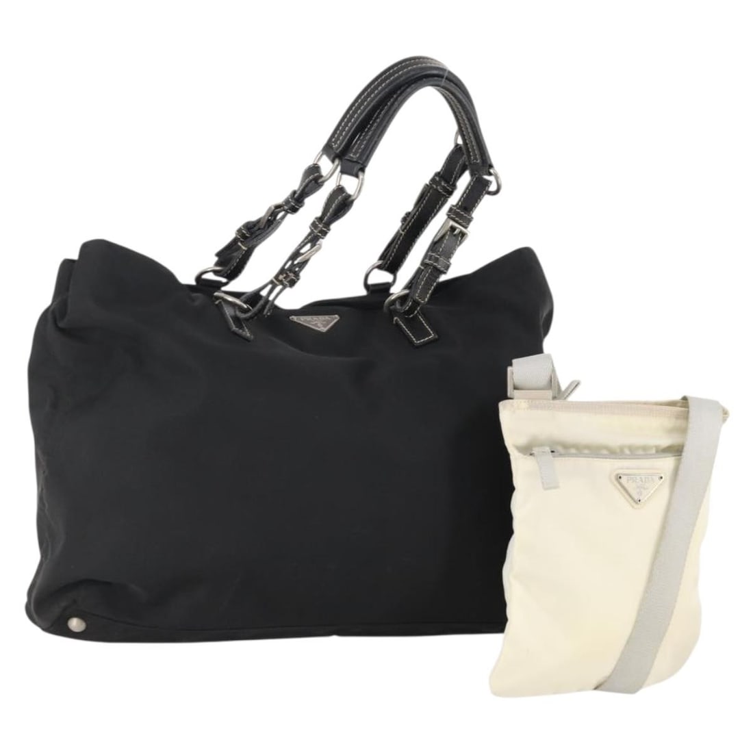PRADA Black White Nylon Hand Bag 2 Piece Set: PRADA Black White Nylon Hand Bag 2 Piece Set Black and white Prada hand bag made of nylon. This special set offer is described as a 2 set and is in heavily used condition, rank C. The listing notes su