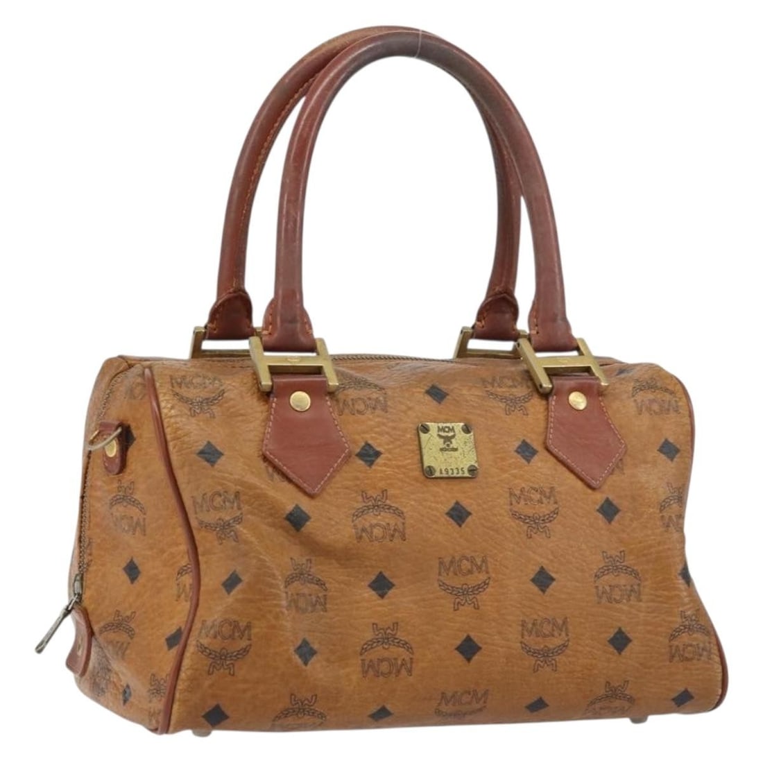 MCM Logogram Vicetos Hand Bag Brown Gold PVC Leather Italy: MCM Logogram Vicetos Hand Bag Brown Gold PVC Leather Italy This MCM Logogram Vicetos Hand Bag showcases a stylish blend of brown and gold PVC leather, offering a luxurious aesthetic. Crafted in Italy,