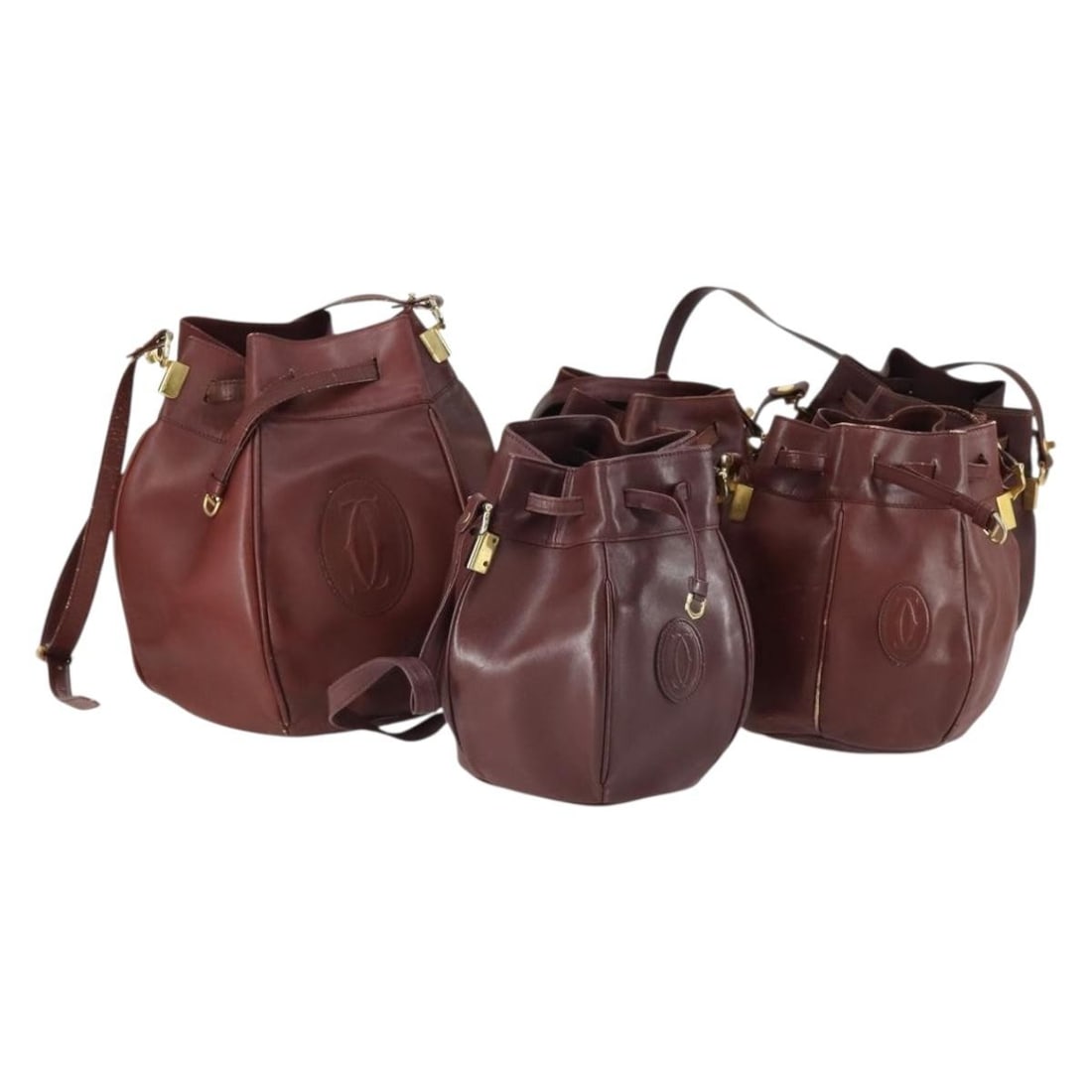 Cartier Must Line Bordeaux Leather Shoulder Bag 5 Piece Set: Cartier Must Line Bordeaux Leather Shoulder Bag 5 Piece Set Cartier Must Line shoulder bag in leather with a bordeaux and gold color scheme. This special set is offered as shown in the photo, and no i