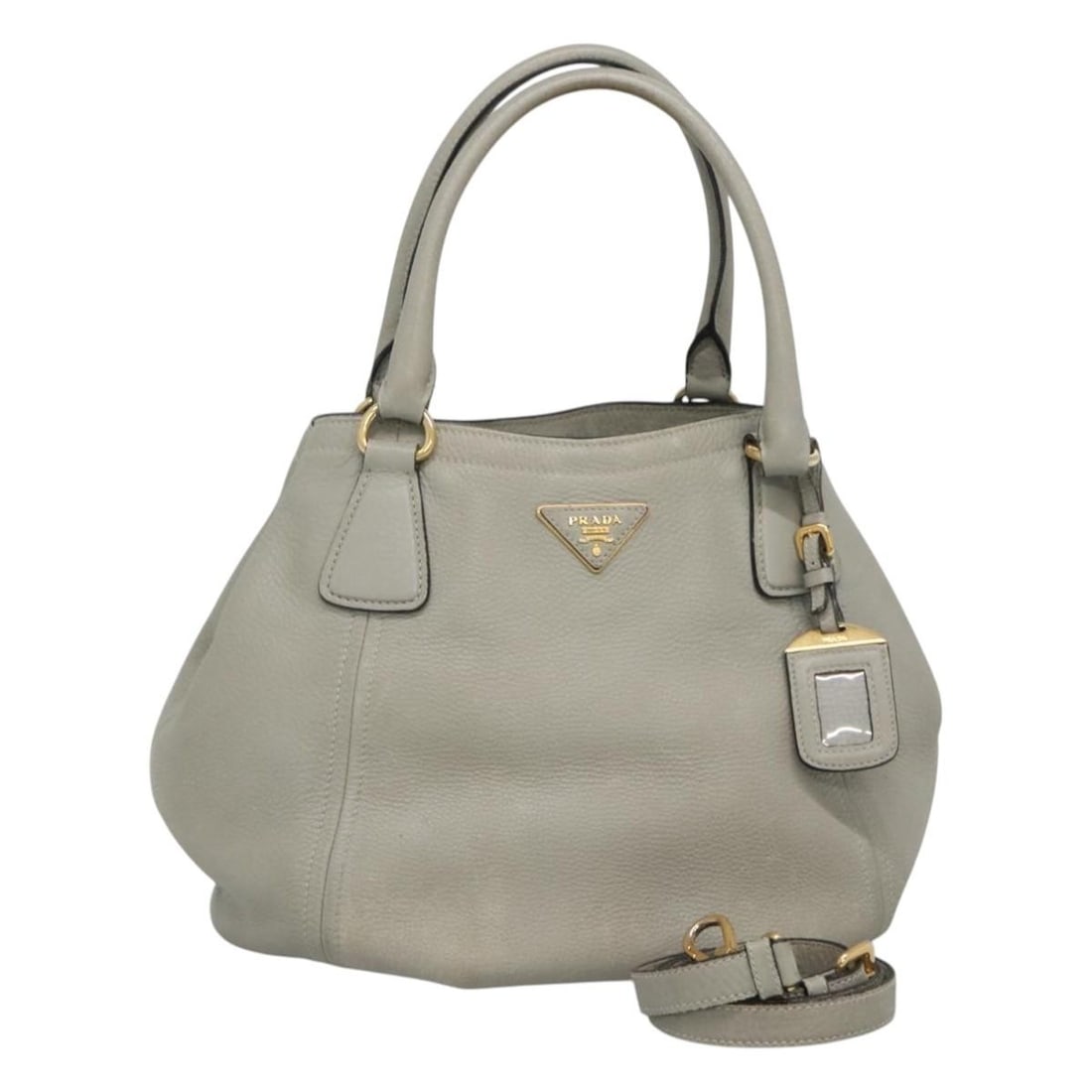 PRADA gray leather shoulder bag with strap and name tag: PRADA gray leather shoulder bag with strap and name tag This PRADA 2-way handbag is crafted from gray leather and offers versatile carrying options with both handles and a detachable shoulder strap. D
