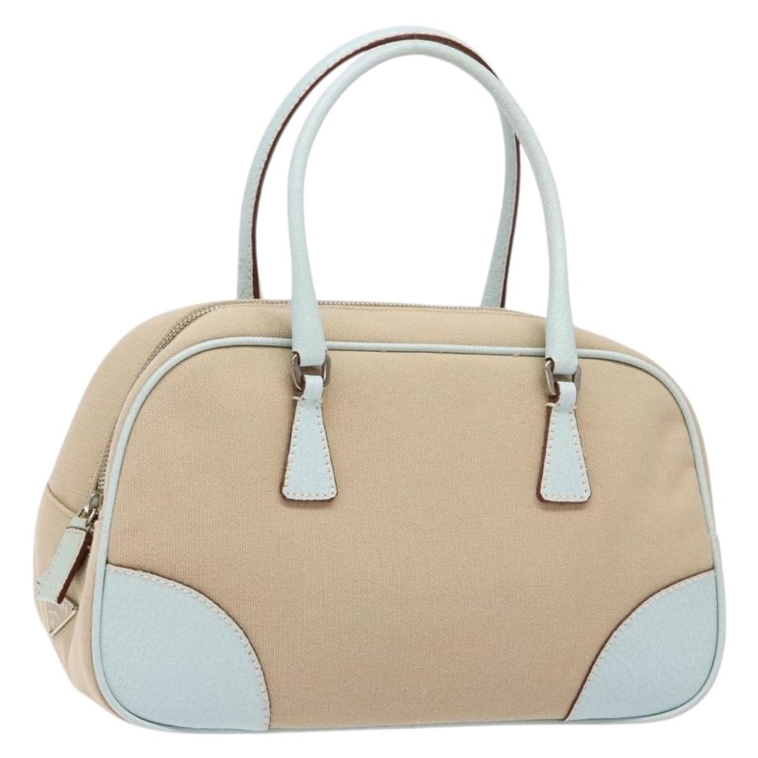 PRADA Beige Silver Canvas Hand Bag Made in Italy: PRADA Beige Silver Canvas Hand Bag Made in Italy A PRADA canvas handbag in beige and silver, made in Italy. It comes with a guarantee card and shows heavy use, with loss of shape, slight rubbing on th