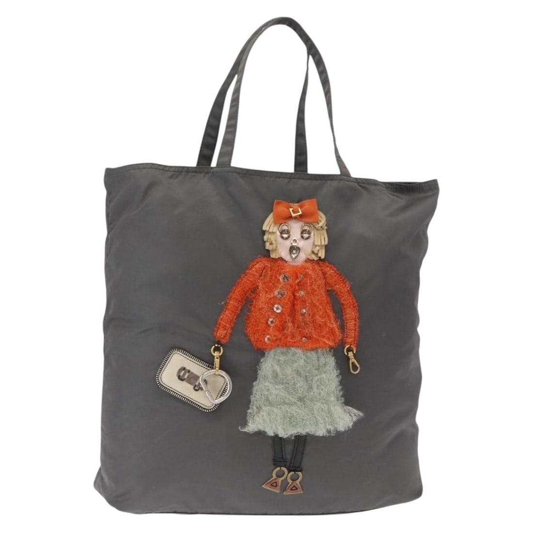 Gray Nylon Tote from Prada Italy with Silver Accents: Gray Nylon Tote from Prada Italy with Silver Accents This is a PRADA tote bag crafted from gray and silver nylon. Made in Italy, the bag features a spacious interior and a practical design, ideal for 