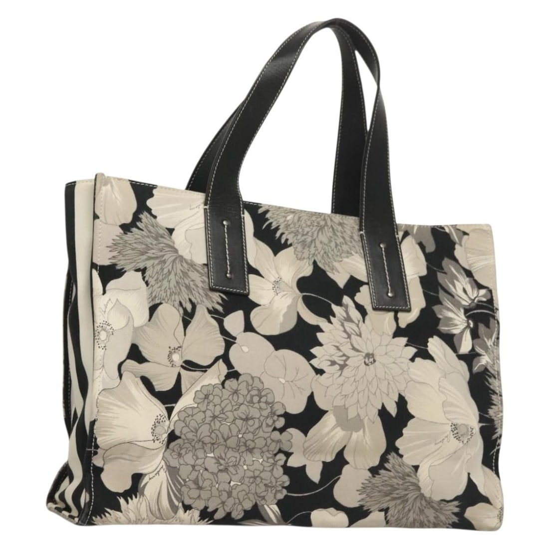 Burberry canvas tote in black and silver 15.7 inch: Burberry canvas tote in black and silver 15.7 inch This BURBERRY tote bag features a classic design crafted from black and silver canvas. The bag offers ample space for daily essentials with approxima