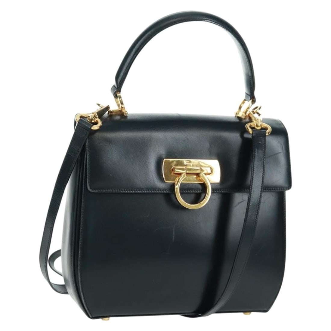 Black Leather Gancini 2way Handbag by Salvatore Ferragamo with Gold Accents: Black Leather Gancini 2way Handbag by Salvatore Ferragamo with Gold Accents This Salvatore Ferragamo Gancini handbag is crafted from black leather with gold-tone accents and offers versatile 2-way car