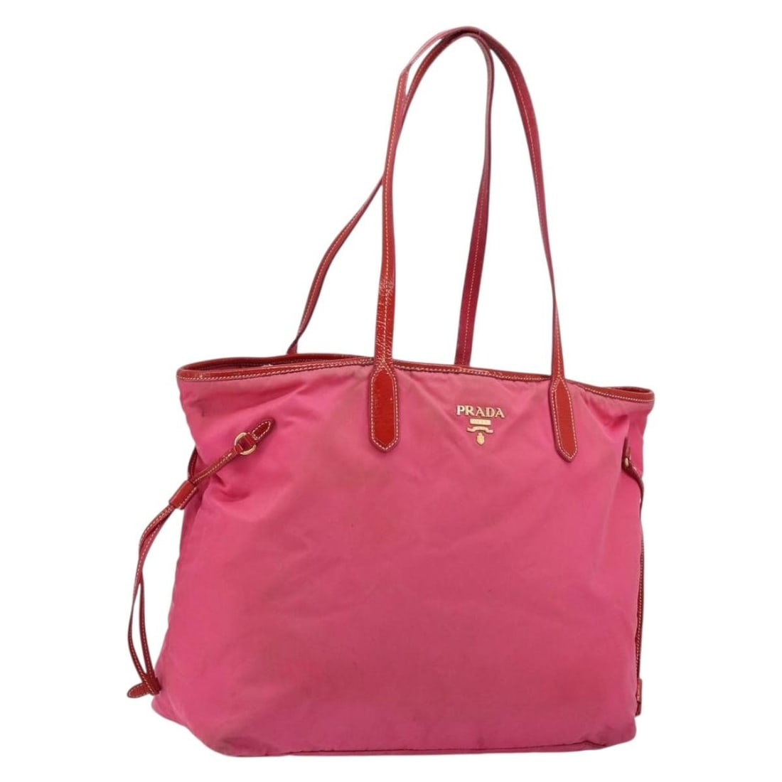 Prada Pink Gold Nylon Tote Bag with Guarantee Card: Prada Pink Gold Nylon Tote Bag with Guarantee Card This PRADA tote bag is crafted from pink and gold nylon and features a spacious design, making it suitable for daily use. The bag is made in Italy an