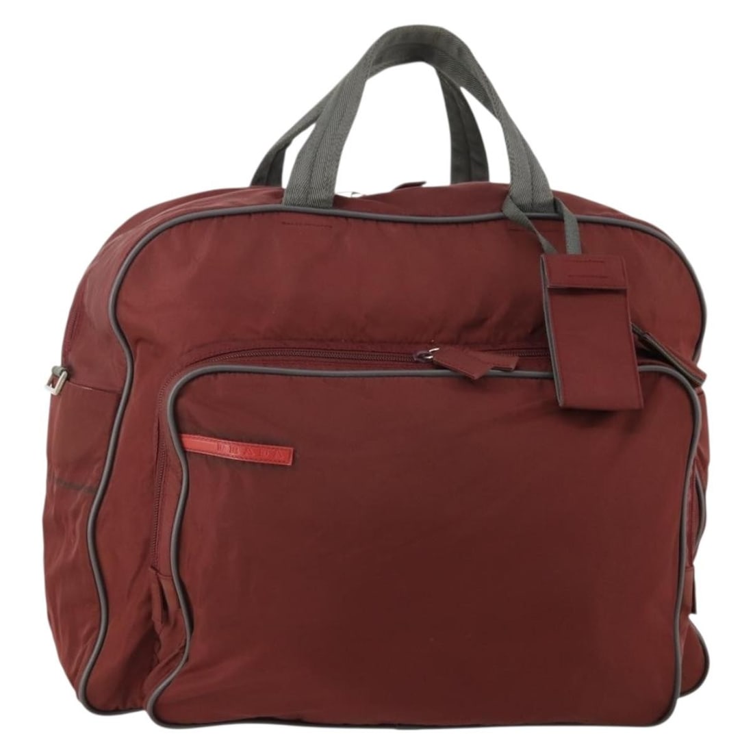 PRADA Boston Bag in Bordeaux Nylon with Padlock Key and Tag: PRADA Boston Bag in Bordeaux Nylon with Padlock Key and Tag This Prada Boston bag is crafted from nylon in a bordeaux and silver colorway. Made in Italy, it features a structured Boston bag style with