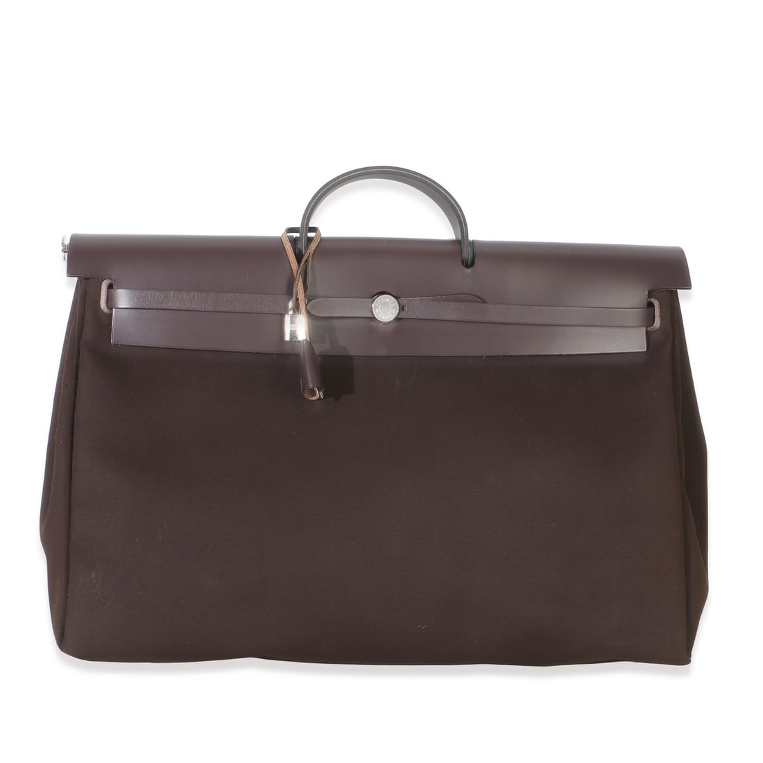 Hermes Herbag Zip Cabine shoulder bag Chocolat Toile Officier canvas: Hermes Herbag Zip Cabine shoulder bag Chocolat Toile Officier canvas Pre-owned Hermes Herbag Zip Cabine Bag in brown canvas with a loop closure and silver-tone hardware. This unisex bag features a sho