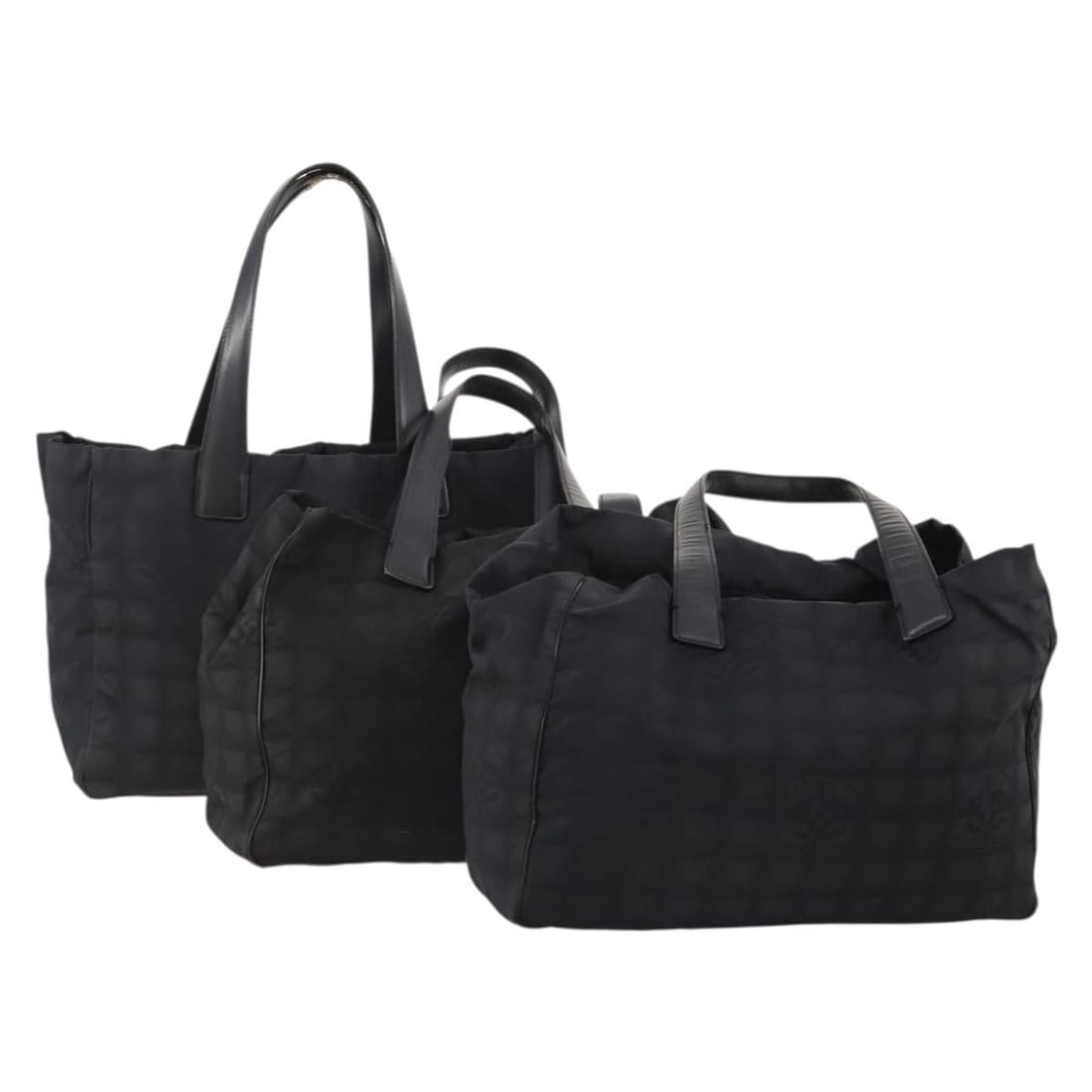 CHANEL Black Nylon Tote Bag 3 Piece Bundle: CHANEL Black Nylon Tote Bag 3 Piece Bundle This is a CHANEL Travel Line tote bag set crafted from black nylon. The set is designed for women and features the iconic CHANEL style. Please note that the 